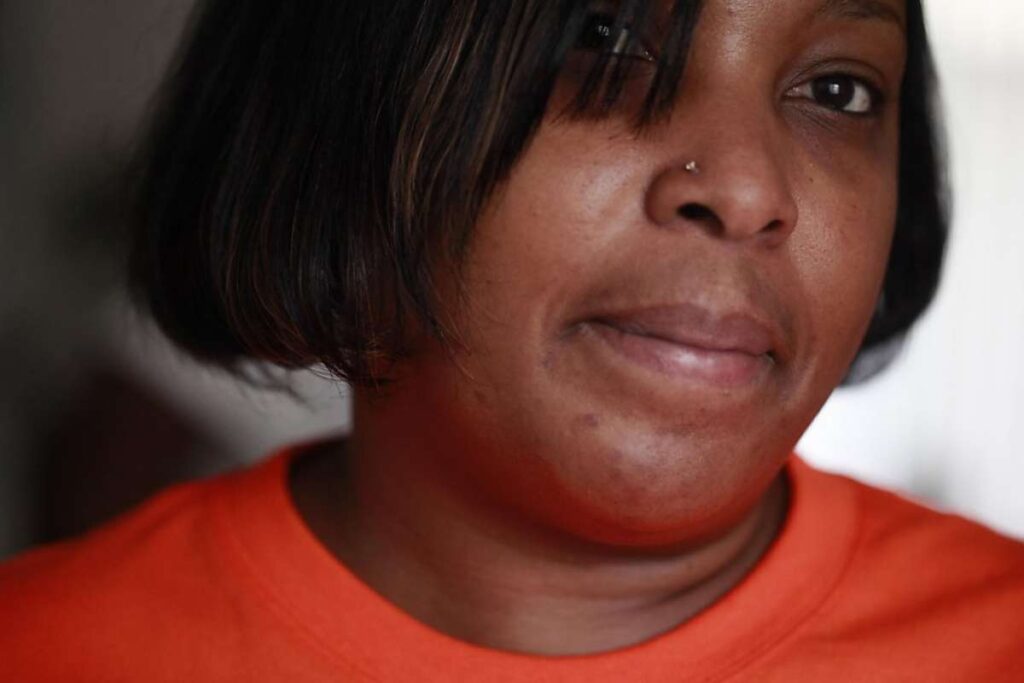 Close up of woman's face with nose piercing.