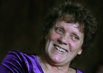 Woman smiles affectionately.
