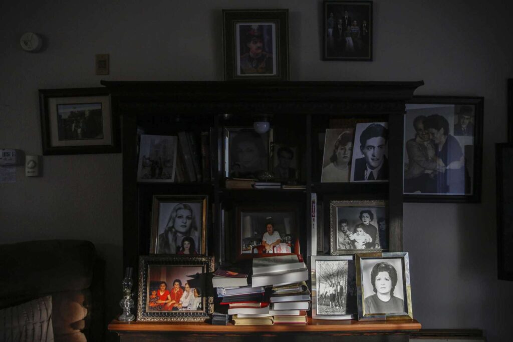 A room lined with bookshelves, portraits, and keepsakes—highlighting history and storytelling through space.