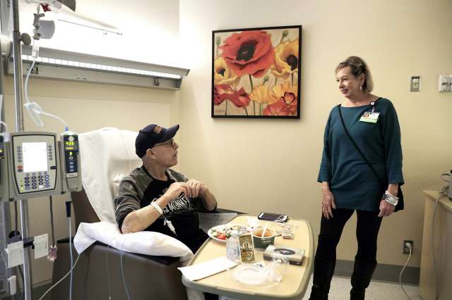 Elderly man undergoes chemotherapy.
