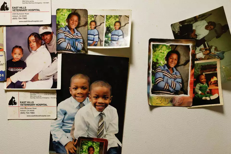 Children’s portraits on a colorful wall—celebrating childhood and identity.