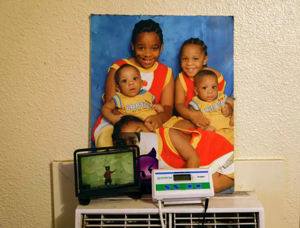 A family portrait with young children sits beside medical equipment—signifying home care and family.
