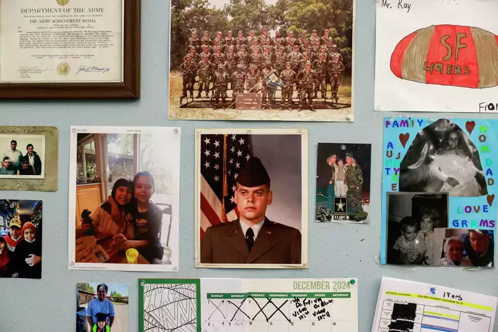School office wall filled with photos and art—representing creativity and inclusion.
