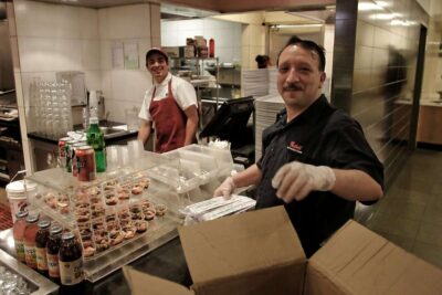 Two men working in a kitchen.