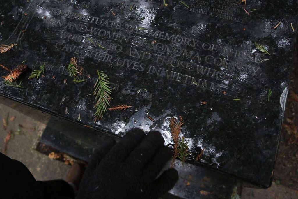 Close up of engraving on Vietnam War memorial.